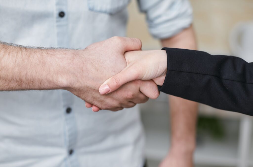 Two people shaking hands.