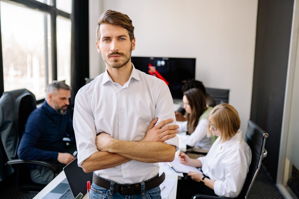 A man standing in a conference room.